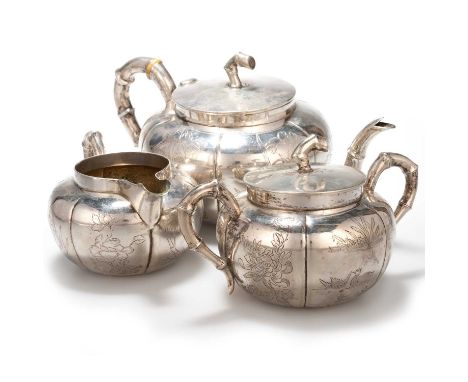 A CHINESE SILVER THREE-PIECE TEA SERVICE  § retailer's mark of Shing Wo/Sw, artisan workshop of Ren An, each piece tapering l