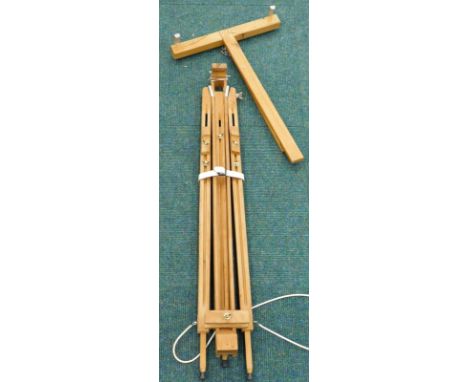 A beech artist's easel, with brass screws, when closed 90cm high.