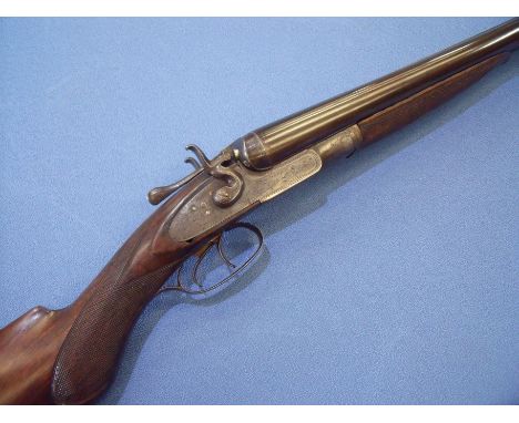 10 bore R Dawson double barrelled hammer shotgun with 32 inch steel barrels and 2 & 7/8ths chambers with top lever opening an