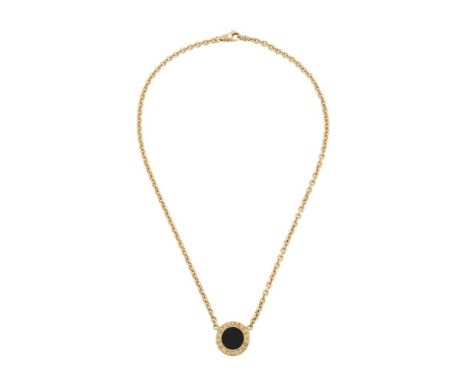 BULGARI, BULGARI BULGARI, AN ONYX AND GOLD COLOURED PANEL NECKLACE  The circular polished onyx panel within a gold coloured b