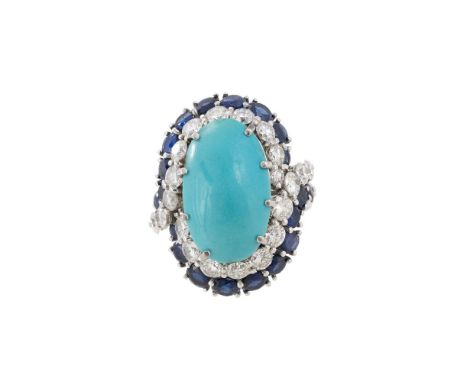 A MID 20TH CENTURY DIAMOND, SAPPHIRE AND TURQUOISE DRESS RING  The central oval cabochon turquoise in an eight claw setting, 