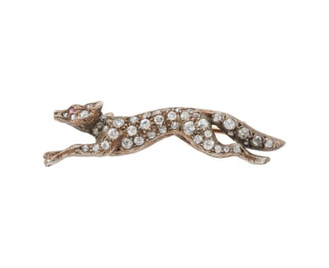 A LATE VICTORIAN DIAMOND FOX BROOCH  CIRCA 1890  The silver galloping fox set with old European cut, eight cut and rose cut d