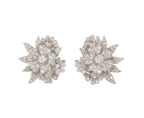 A PAIR OF MID 20TH CENTURY FLORAL SPRAY EAR CLIPS The ear clips each composed of four graduated pavé set diamond five petaled
