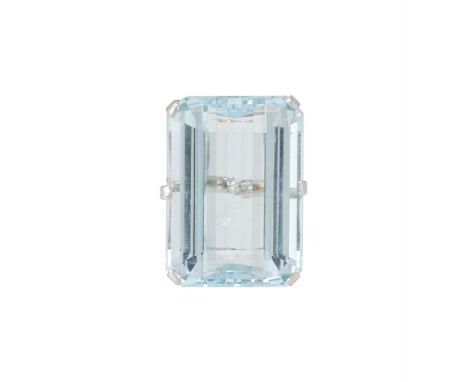 AN AQUAMARINE DRESS RING  The step cut aquamarine with canted corners in a six claw setting, approximately 34.07 carats total