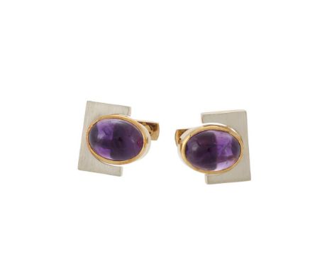 PRETELT, A PAIR OF CABOCHON AMETHYST CUFFLINKS   CIRCA 1980 The oval cabochon amethyst cufflinks within a gold coloured colle