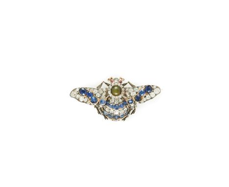 A VICTORIAN SAPPHIRE, DIAMOND, RUBY AND CATS EYE CHRYSOBERYL BEE BROOCH  CIRCA 1880  The outstretched wings set with old mine