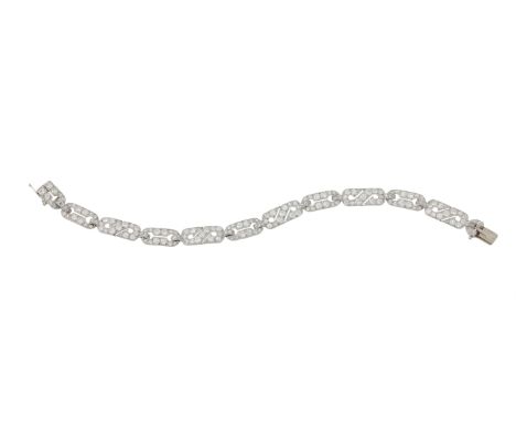 A FRENCH ART DECO DIAMOND BRACELET  CIRCA 1930  The alternating pierced anchor link and scrolled links set with old European 