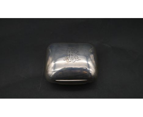 A silver cushion shaped box with gilded interior. Hallmarked NM for Norman Marshall, London, 1895. Engraved monogram to the t