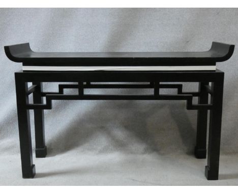 A contemporary Chinese style console table with tray top above pierced frieze on square supports. H.85 L.135 W.40cm 