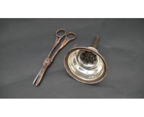 A sterling silver wine funnel and a pair of silver grape scissors with vine relief decoration. Funnel hallamarked DRM for Dav