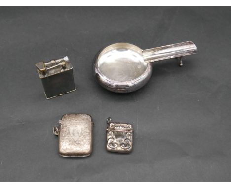 A collection of silver tobacciana items. Including a Links of London cigar holder and ashtray, two vesta cases and a match bo