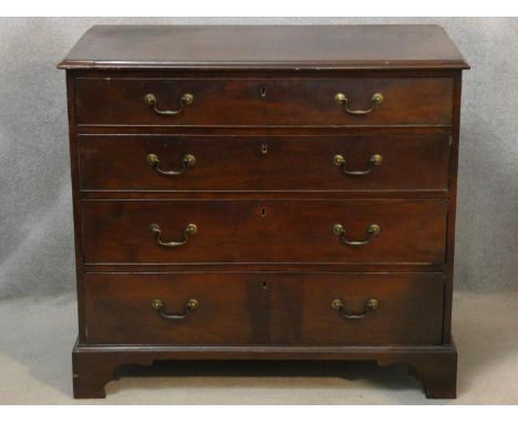 A Georgian mahogany chest of four long graduating drawers on ogee bracket feet. H.85 W.95 D.50cm 