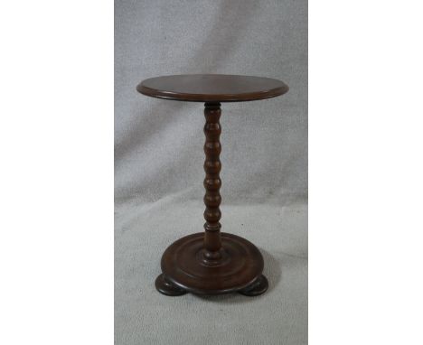 A Victorian mahogany lamp table on bobbin turned column on platform base. H.65 L.43 W.43cm 