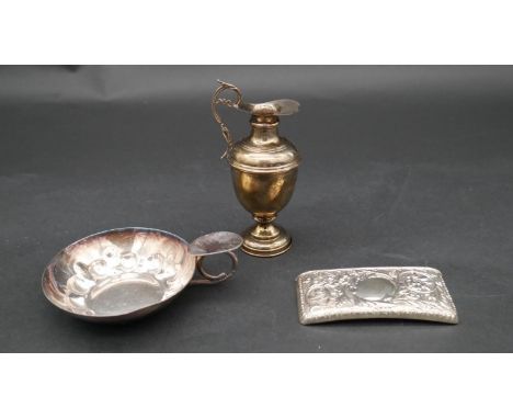 A collection of silver items. Including A miniature silver Grecian style water pitcher, a repousse design card sleeve and a s