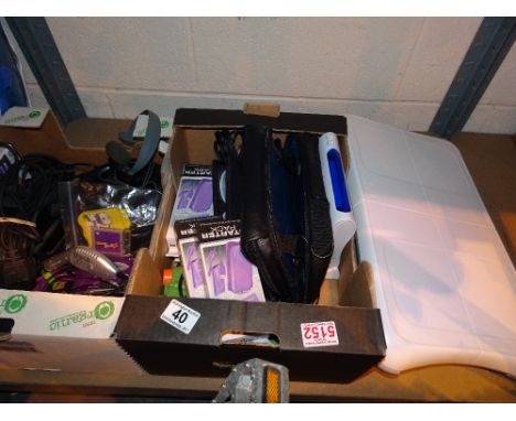 Two boxes of assorted games console accessories including Wii Fit board