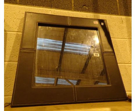 Leather framed mirror and a wooden standard lamp