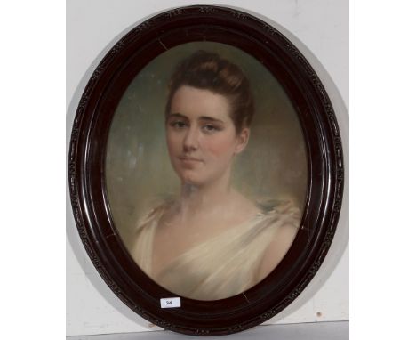 Late 19th Century British School - A bust portrait of a young woman in a white dress, pastel, 47 x 37cms, oval, in frame.