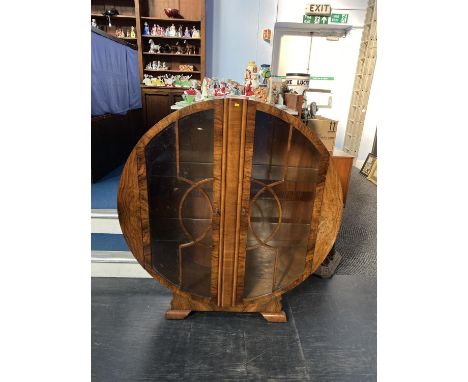 An Art Deco walnut spherical china cabinet