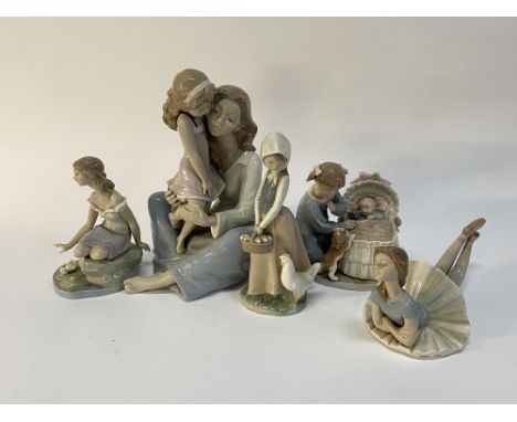 A Lladro porcelain figure group depicting mother and child, 28cm H and four other Lladro, Nao and Nadal ornaments