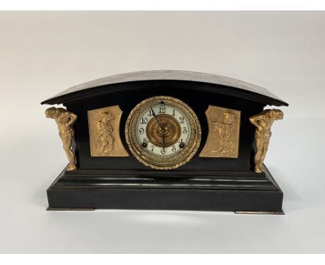 A 19th Century slate mantel clock, the domed top above an enamelled Arabic dial flanked either side by gilt metal embellishme