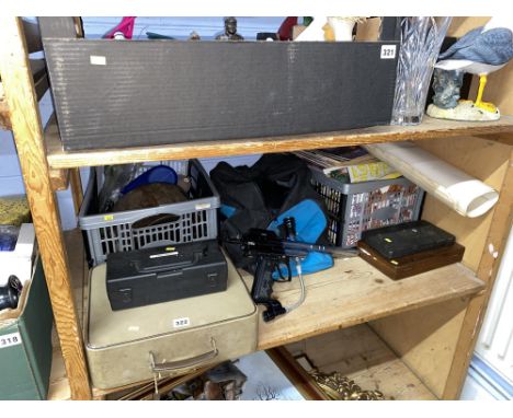A shelf of records, LPs, Spyder Aggressor paintball gun and other items