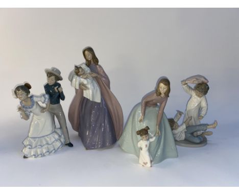 A Nao figural ornament of a woman with child, 40cm H and three other Nao ornaments