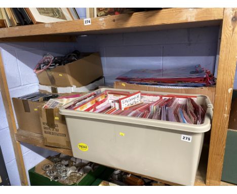 A shelf of decorations for parties, picture frames and greeting cards