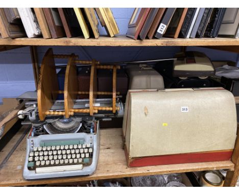 A shelf of LPs, records, vintage sewing machine, a Ewbank and typewriter