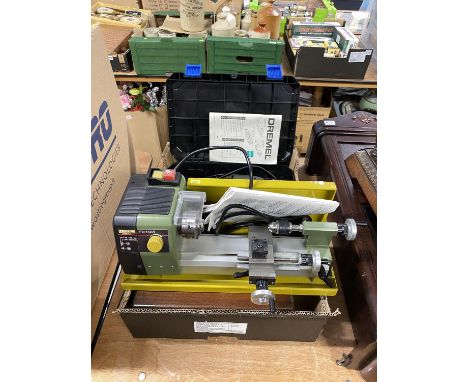 A Proxxon FD 150/E precision lathe, a stained wood table box containing tools for the lathe and a Dremel 3000 multi tool