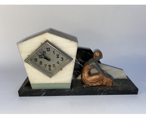 A Continental Art Deco spelter and marble mantel clock, the angular case enclosing a silvered Arabic dial and placed beside a