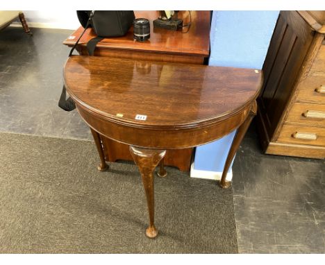 A mahogany half moon card table