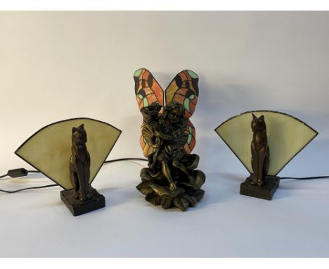 A pair of reproduction Art Deco style table lamps modelled as seated cats, 23cm H and another with Tiffany style butterfly wi