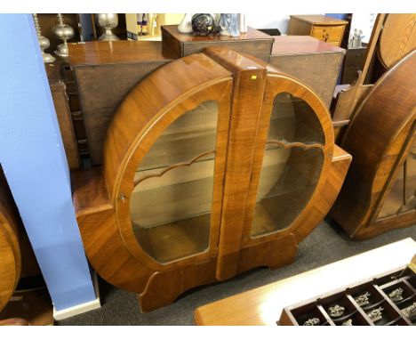 An Art Deco walnut spherical china cabinet