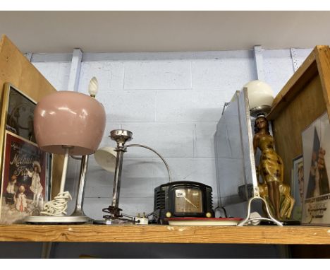 An Art Deco firescreen, 50cm x 60cm, various advertising prints, lamps and an Art Deco chalkware figural lamp