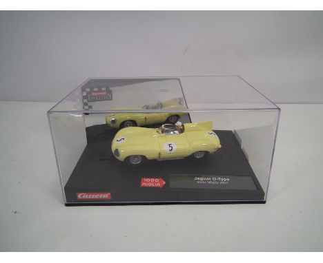Carrera Evolution - A boxed Jaguar D Type Mille Miglia 2001 car # 25708. The car appears Mint in a Very Good display case. (T