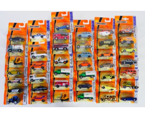 Matchbox - A carded collection of 41 Matchbox diecast model vehicles. Lot includes L0369 Jaguar XK; L0343 Austin Mini Van; L0