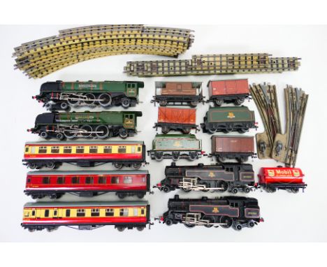 Hornby Dublo - An unboxed group of four Hornby Dublo 3-rail locomotives, with a collection of rolling stock and 3-rail track.