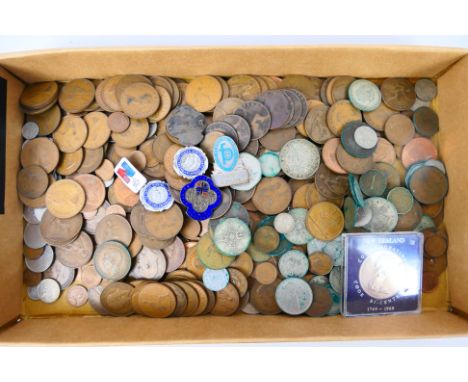 A quantity of coins, Victorian and later, a small quantity with silver content and a collection of nursing and similar badges