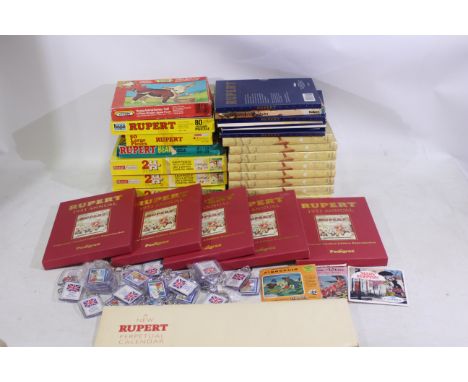 Rupert The Bear - A collection of Rupert The Bear collectables consisting of 19 x Rupert The Bear facsimile/reproduction Annu