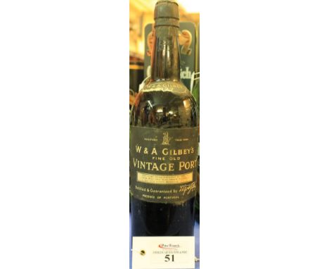 Bottle of W&A Gilbey's fine old vintage port marked 1927. CONDITION REPORT: Labels, particularly top neck label ripped and lo