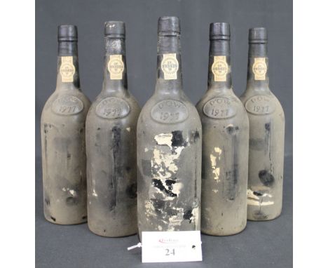 Five bottles of Dow's 1977 vintage port.  (5) CONDITION REPORT: All labels almost entirely gone.  One bottle has the remnants