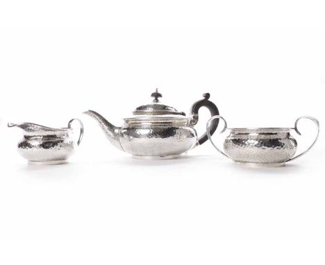 EARLY 20TH CENTURY SILVER PLATED THREE PIECE TEA SERVICE
of attractive round planished form, teapot 13cm high