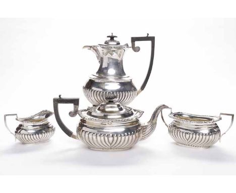 EDWARDIAN SILVER THREE PIECE TEA SERVICE AND MATCHING HOT WATER POT
maker Charles Horner, Birmingham 1903, hot water pot 1905