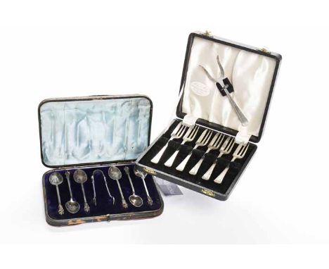 SET OF SIX LATE VICTORIAN SILVER APOSTLE TEASPOONS AND TONGS
maker Martin, Hall & Co, Sheffield 1898, inside a fitted case, e
