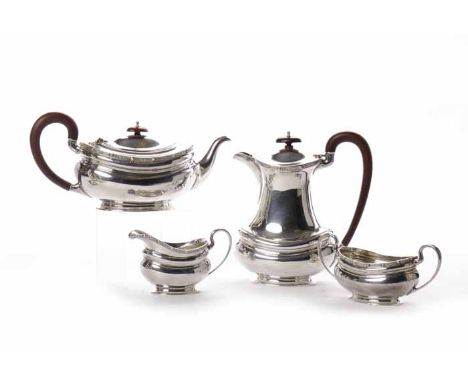 SILVER FOUR PIECE TEA SERVICE
maker Fenton, Russell & Co Ltd, Birmingham 1936, of rectangular form with Celtic style rim, app