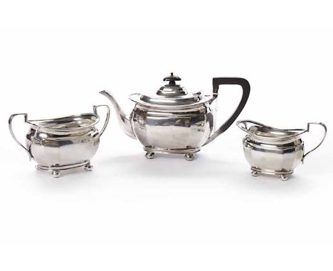 GEORGE V SILVER THREE PIECE TEA SERVICE
maker Atkin Brothers, Sheffield 1922, of faceted rectangular form, threaded rims, eac