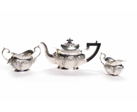 EDWARDIAN SILVER THREE PIECE BACHELOR'S TEA SERVICE
maker Williams (Birmingham) Ltd, Birmingham 1902-3, of lobed oval form, e