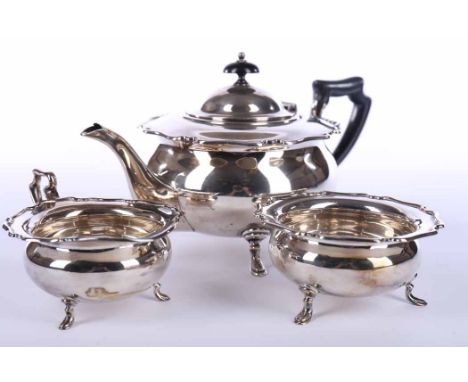 SILVER THREE PIECE TEA SERVICE
maker Atkin Brothers, Sheffield 1939, of round form with serpentine rim, each on three short l