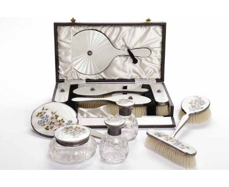 TWO SILVER AND GUILLOCHE ENAMEL DRESSING TABLE SET
including a six piece floral enamel set, maker Henry Clifford Davis, Birmi