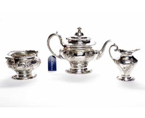 EDWARDIAN SCOTTISH SILVER THREE PIECE TEA SERVICE
maker John Alexander Fettes, Glasgow 1903, of round form with embossed scro